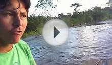 Canoe fisher on Amazon river near Iquitos, region Loreto, Peru